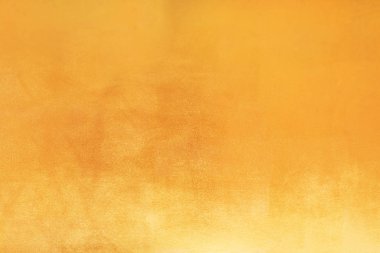 Altın soyut arkaplan veya doku ve gradyan gölgesi.
