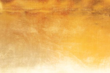 Altın soyut arkaplan veya doku ve gradyan gölgesi.