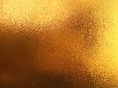 Altın soyut arkaplan veya doku ve gradyan gölgesi.
