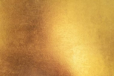Altın soyut arkaplan veya doku ve gradyan gölgesi.
