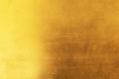 Altın soyut arkaplan veya doku ve gradyan gölgesi
