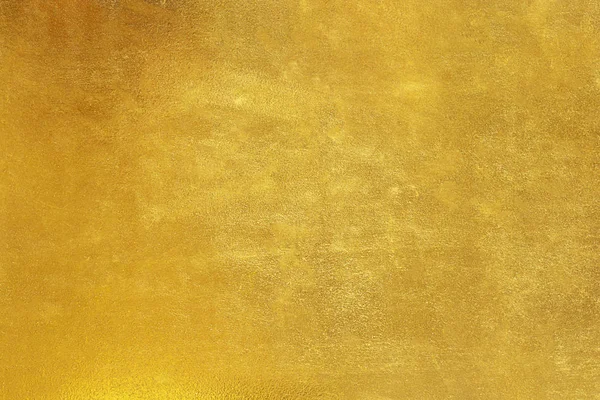 Feuille jaune brillant feuille d'or texture fond. — Photo