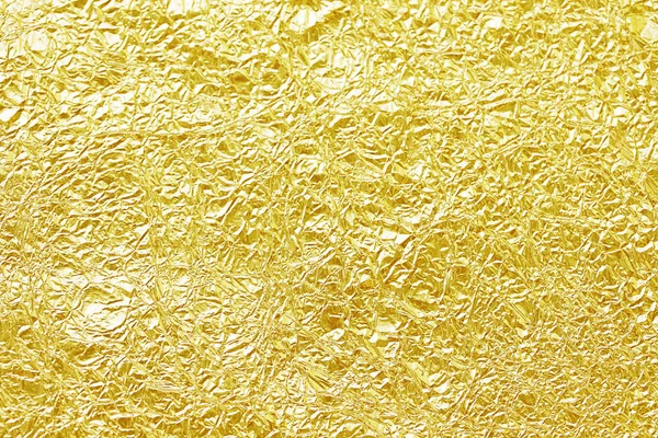 Shiny gold leaf foil texture background — Stock Photo, Image