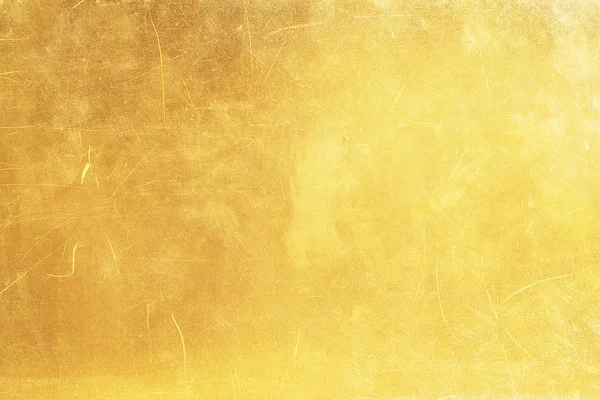 Guld abstrakt bakgrund eller textur nöd scratch och gradie — Stockfoto
