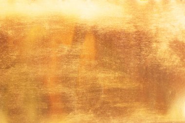 Altın soyut arkaplan veya doku ve gradyan gölgesi.