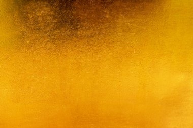 Altın soyut arkaplan veya doku ve gradyan gölgesi.