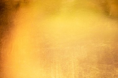 Altın soyut arkaplan veya doku ve gradyan gölgesi.