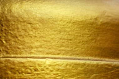 Altın soyut arkaplan veya doku ve gradyanlar yatay gölge şekli