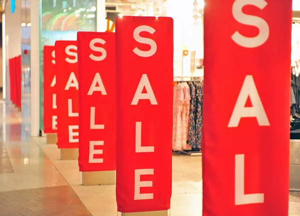 Sale red signs at retail store