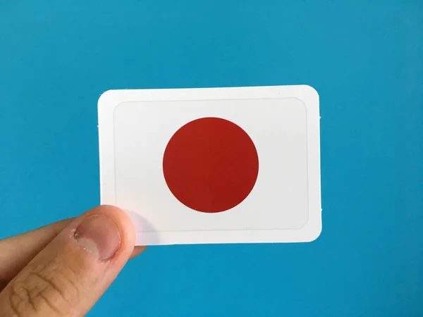 在蓝色背景的日本国旗 — 图库照片