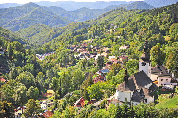 Beautiful church in green hills of Spania dolina, Tatras, Slovakia