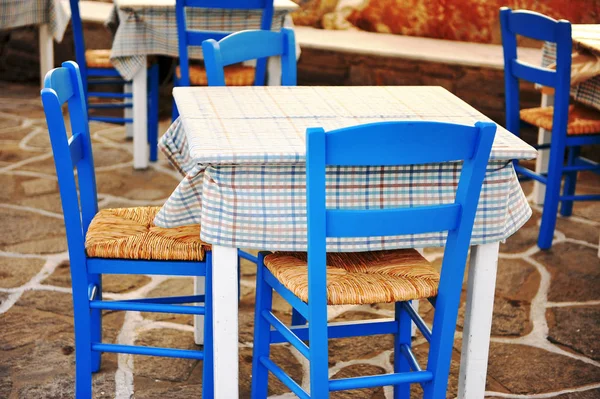 Light blue cafe tables and chairs in mediterranean style