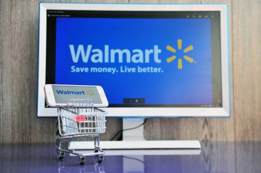 Walmart şirketin logosu ile cep telefonu ve bilgisayar ekranı