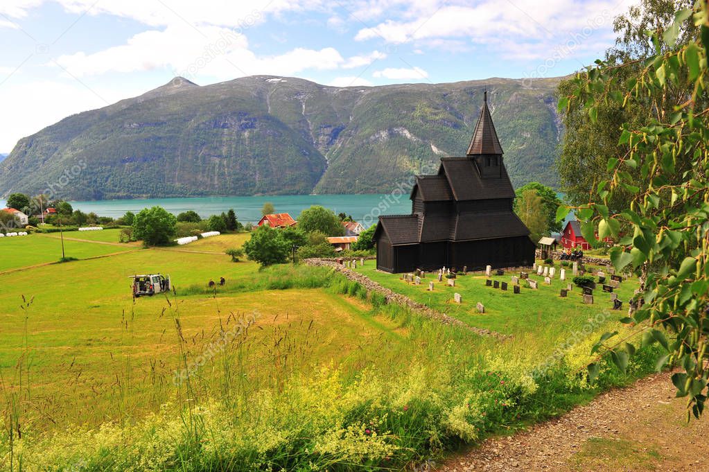 Amazing landscape with old stave church on fjords