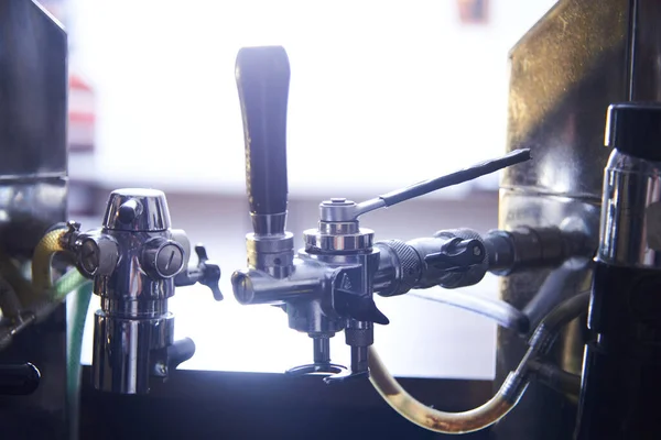 beer equipment close-up. Beer bar on international beer day. Brewing at home.Draught beer stores