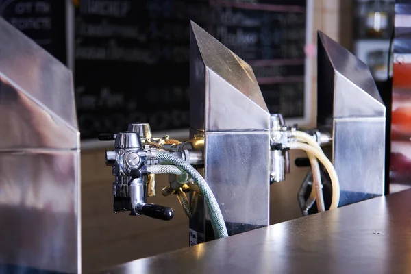 beer equipment close-up. Beer bar on international beer day. Brewing at home.Draught beer stores