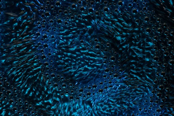 abstraction in the form of bubbles and ripples of water of dark blue color