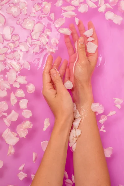 Top View Female Hands Bathtub Pink Water Petals Spa Care — Stock Photo, Image
