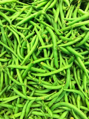 güzel closeup parlak yeşil iştah açıcı taze fasulye, arka plan görünümünü ayrıntılı