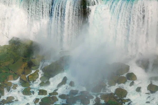 Force of nature, amazing great stunning closeup view of the Bottom of Niagara falls with its heavy powerful water fall, background