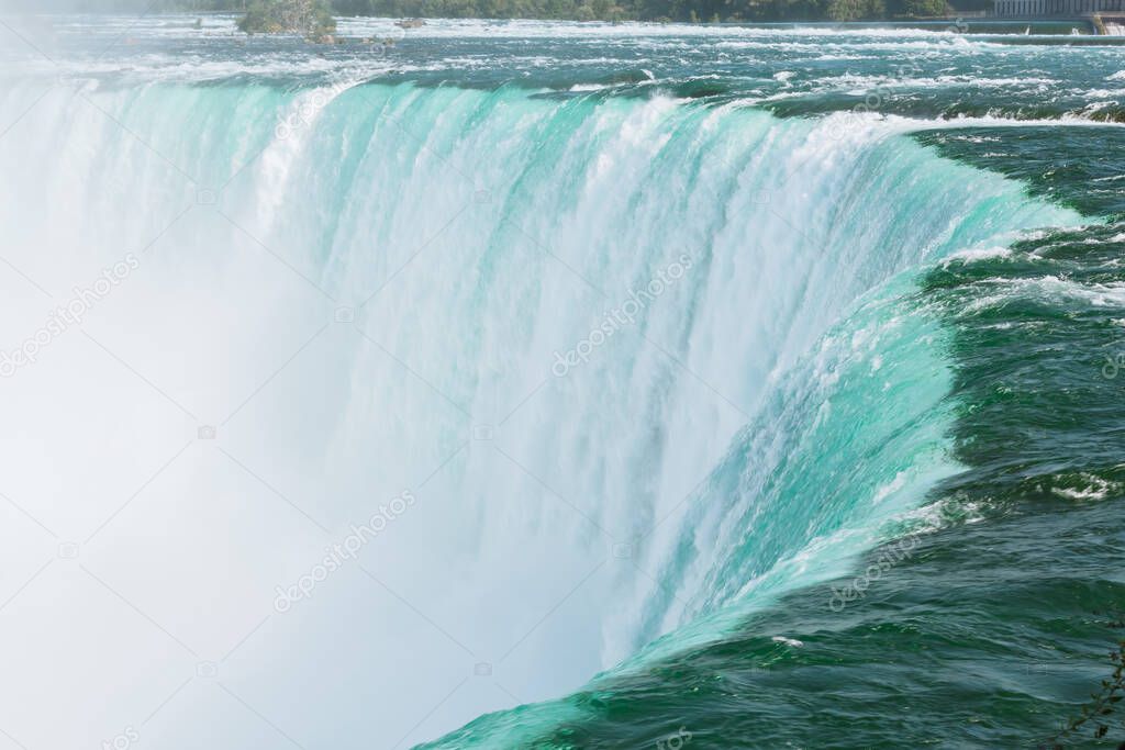 Inviting mesmerizing beautiful closeup view on Niagara falls falling water, force of nature 