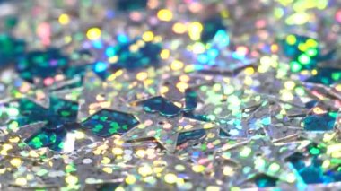 Gümüş glisten yıldız döner. Bokeh ile parlak arka plan. Noel veya tatil tema. 4k