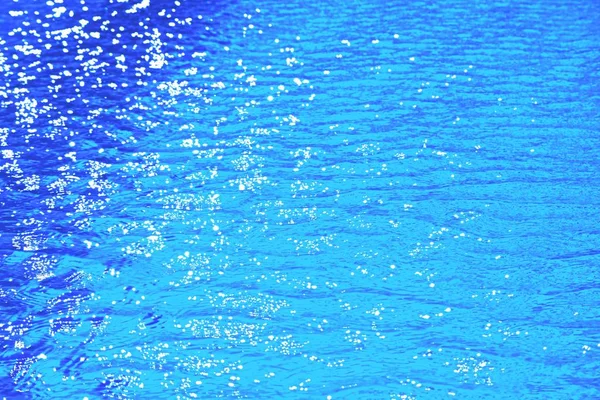 Scenic water surface with reflection of daylight over outdoor swimming pool in close up and minimal style so beautiful pattern for awesome nature texture background