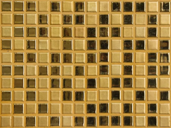 Luxury golden square shape tile pattern wall background.
