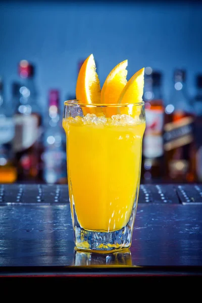 Yellow drink cocktail with orange slices — Stock Photo, Image