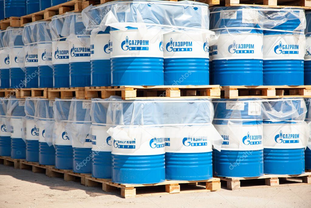 Rostov-on-Don, Russia. 08.08.2020. Engine oil in Gazprom Neft barrels are stored in several rows in the warehouse.