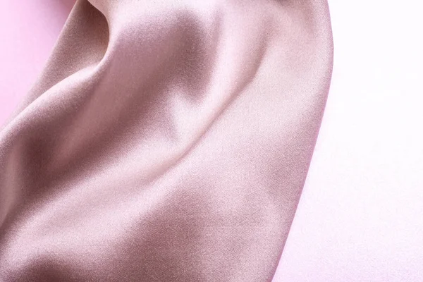 Pembe inci kağıtta yumuşak ipek kumaşların soyut arkaplanı. Güzel eğilim dokusu.