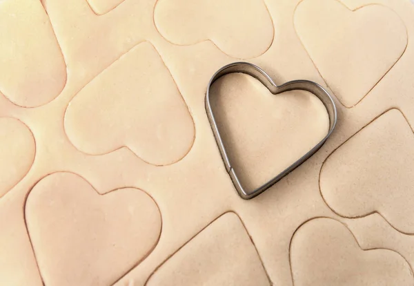 Dough for cookies. A mold for cutting cookies in the form of heart. St. Valentines Day. Top view — Stock Photo, Image
