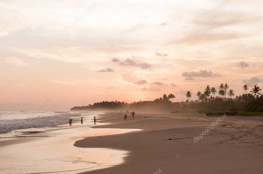 View of coast line in Koggala, Sri Lanka, boulders in the Indian ocean at the sunset