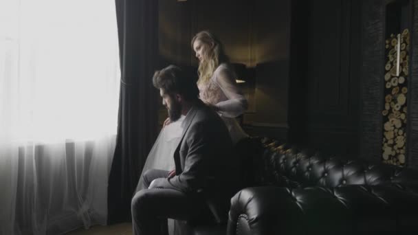 Slow Motion Severe Bearded Man Grey Sits Black Leather Sofa — 图库视频影像