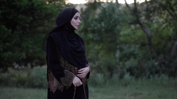 Nice lady in long black arabian dress hijab on head — Stock Video