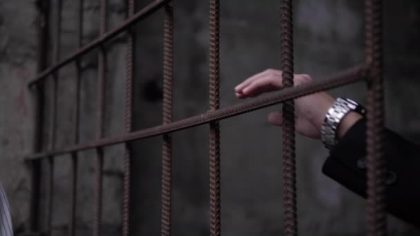 Man and woman put hands on brown rusty grate close view — Stock Video