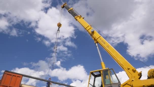 Crane arm with ropes over truck in production factory yard — Stock Video