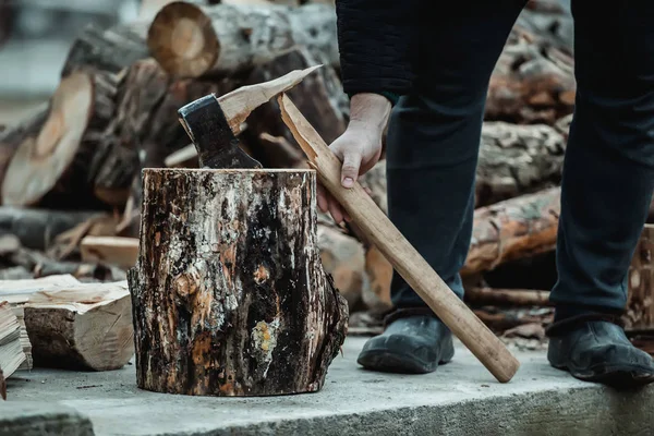 broken axe when chopping wood. The woodcutter broke the tool.