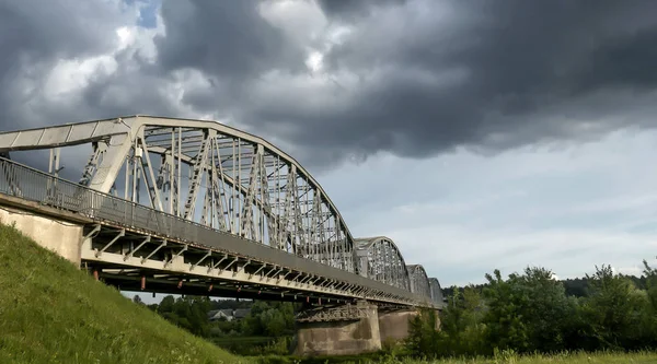 Car and railway bridge over the river — Stock Photo, Image