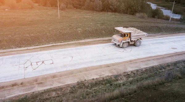 big truck carrying cargo from the quarry