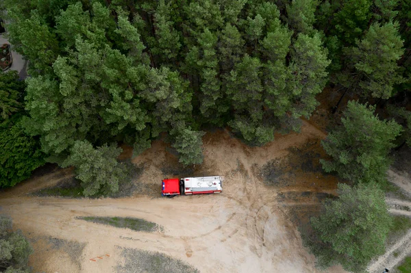 fire truck in the forest top view from a drone.