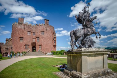 Sculpture and red brick tower, Powis Castle, Wales clipart