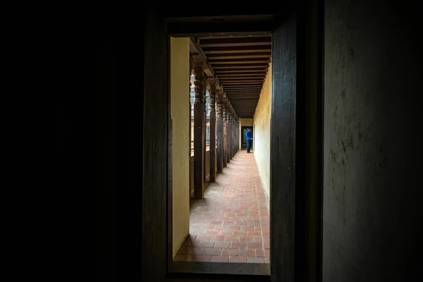 Man about to enter a room of the 55 Window Palace