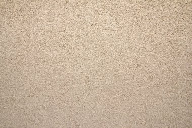 Sarı dokulu duvar güzel çakıl ile sıvalı.