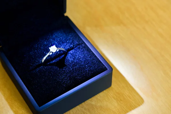 Diamond engagement ring in blue ring box — Stock Photo, Image