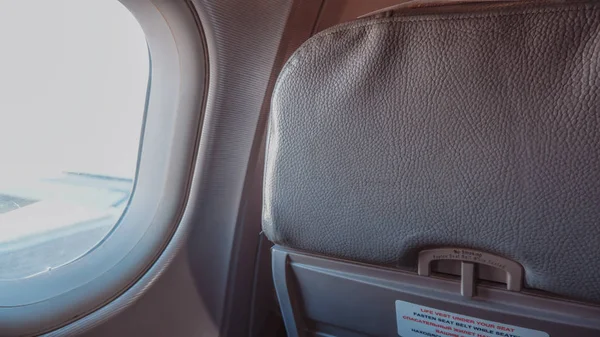 Plane seat with window in flight