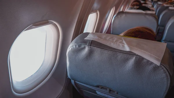 Plane seats with windows in flight
