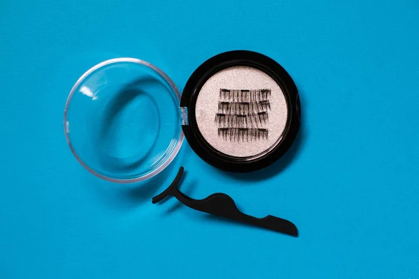 Artificial Magnetic False Eyelashes Set on blue background