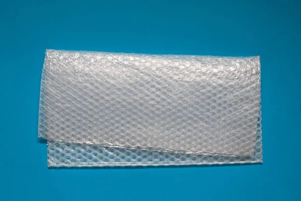 Bubbelplast Blå Bakgrund Bubbelplast Smidig Transparent Plastmaterial Som Används För — Stockfoto