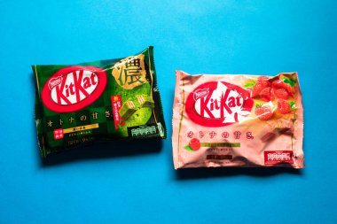 Kit-kat chocolate with matcha green tea and strawberry - large packages with mini bars clipart